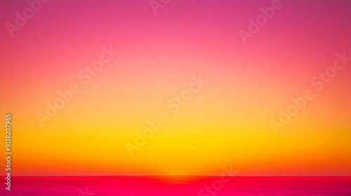 Vibrant pink and yellow sunset over the ocean horizon.