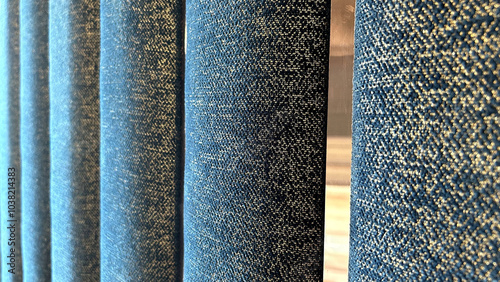 Close-up of blue textured fabric panels with varying shades and patterns, ideal for interior design concepts, textiles, and artistic backgrounds. photo