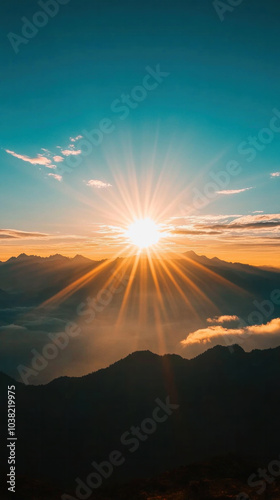 Wallpaper Mural A sun is shining on the mountains, creating a beautiful and serene atmosphere. The mountains are covered in clouds, adding a sense of depth and mystery to the scene Torontodigital.ca