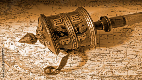 Εκτύπωση καμβά Simulated Victorian photo of an antique  Buddhist  prayer wheel on an antique ma
