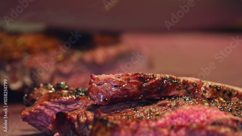 Experience the mouthwatering sizzle of a juicy beef steak on the grill in this up-close video. Watch as the meat sears to perfection, locking in rich flavors and creating that perfect crust. The inten