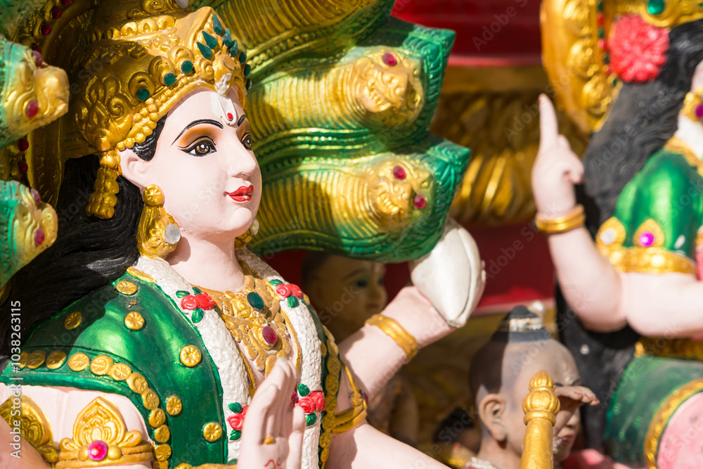 Samut Prakan, Thailand - June, 12, 2024 : Divine Hindu Deity Statue in Thai Temple: A Fusion of Culture and Religion at Samut Prakan, Thailand. Samut Prakan, Thailand - June, 12, 2024 : Divine Hindu Deity Statue in Thai Temple: A Fusion of Culture and Religion at Samut Prakan, Thailand.