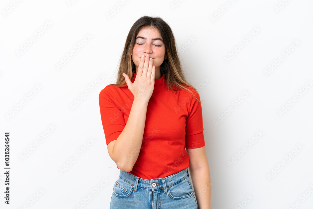 Young caucasian woman isolated on white background covering mouth with hand Young caucasian woman isolated on white background covering mouth with hand