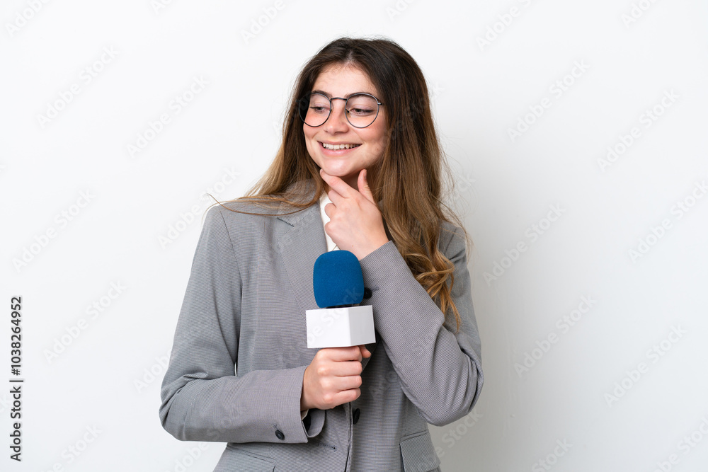 Young caucasian TV presenter woman isolated on white background looking to the side and smiling Young caucasian TV presenter woman isolated on white background looking to the side and smiling