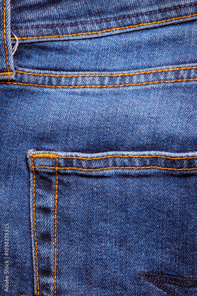 Worn denim trousers. Machine stitch close up. Denim texture in blue. The concept of repairing old clothes. Sewing factory. Fashionable aging clothes. Worn denim trousers. Machine stitch close up. Denim texture in blue. The concept of repairing old clothes. Sewing factory. Fashionable aging clothes.
