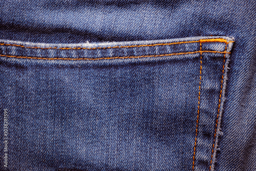 Worn denim trousers. Machine stitch close up. Denim texture in blue. The concept of repairing old clothes. Sewing factory. Worn denim trousers. Machine stitch close up. Denim texture in blue. The concept of repairing old clothes. Sewing factory.