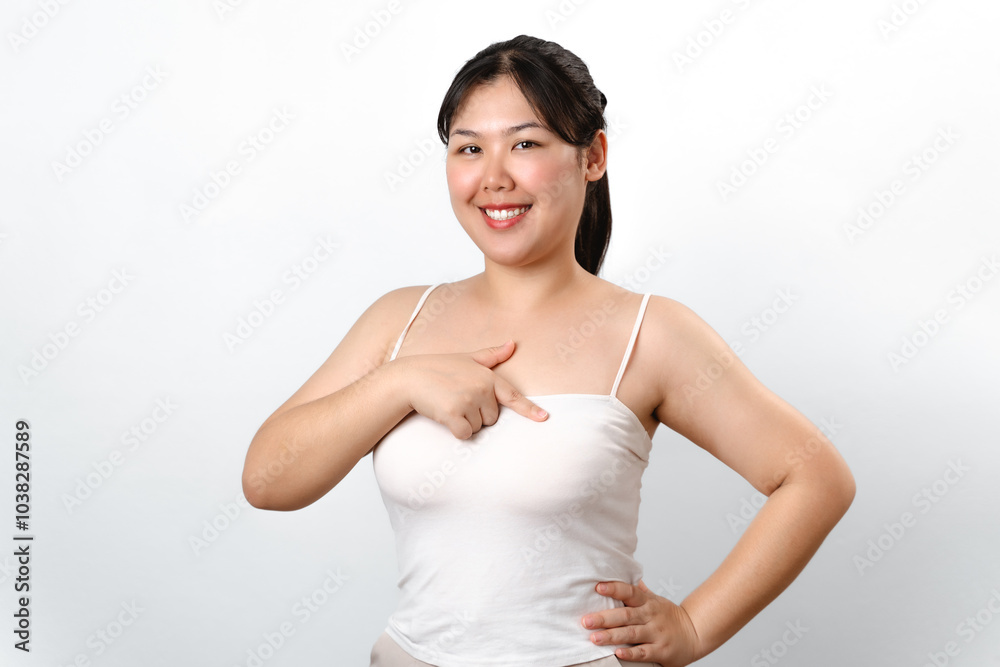 Asian woman checking lumps on her breast for signs of breast cancer on white background Asian woman checking lumps on her breast for signs of breast cancer on white background