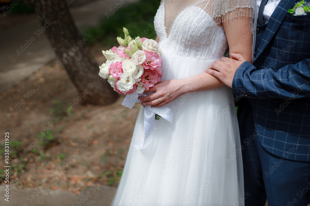 Wedding bouquet in the hands of the bride at the ceremony. Touching the hands of the bride and groom. Wedding jewelry. Wedding rings. The tenderness and beauty of the wedding ceremony. Wedding bouquet in the hands of the bride at the ceremony. Touching the hands of the bride and groom. Wedding jewelry. Wedding rings. The tenderness and beauty of the wedding ceremony.
