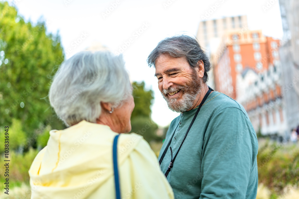 Senior lovers standing in the city park Senior lovers standing in the city park