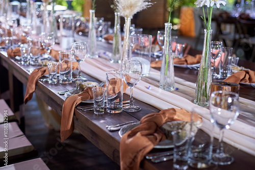 Wedding decoration. Floristics. Vessels with candles and bulk wax. Transparency and ease of design. Blue flowers and pampas.
