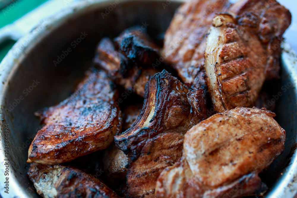 Juicy grilled steaks. Barbecue on the street. Cooking meat on the barrel with a grill. Juicy grilled steaks. Barbecue on the street. Cooking meat on the barrel with a grill.