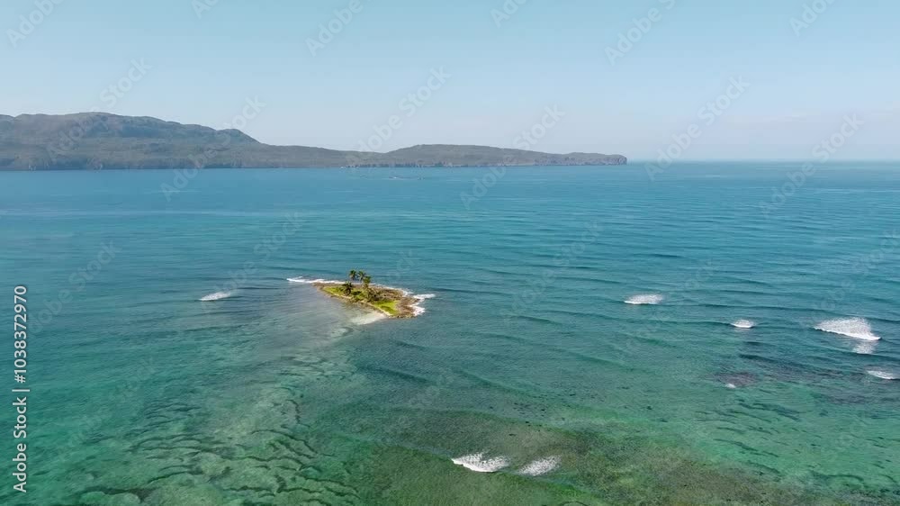 Aerial view of a small Caribbean island, panoramic view of the island, reef and crystal clear water. Dominican Republic.