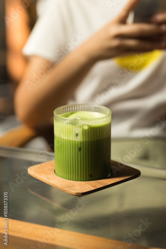Enjoy a refreshing Iced Matcha Green Tea, perfect for a hot day.