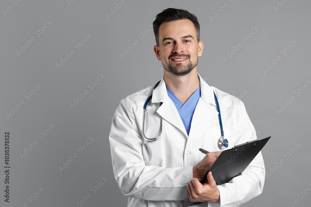 Smiling doctor with stethoscope and clipboard on grey background, space for text Smiling doctor with stethoscope and clipboard on grey background, space for text
