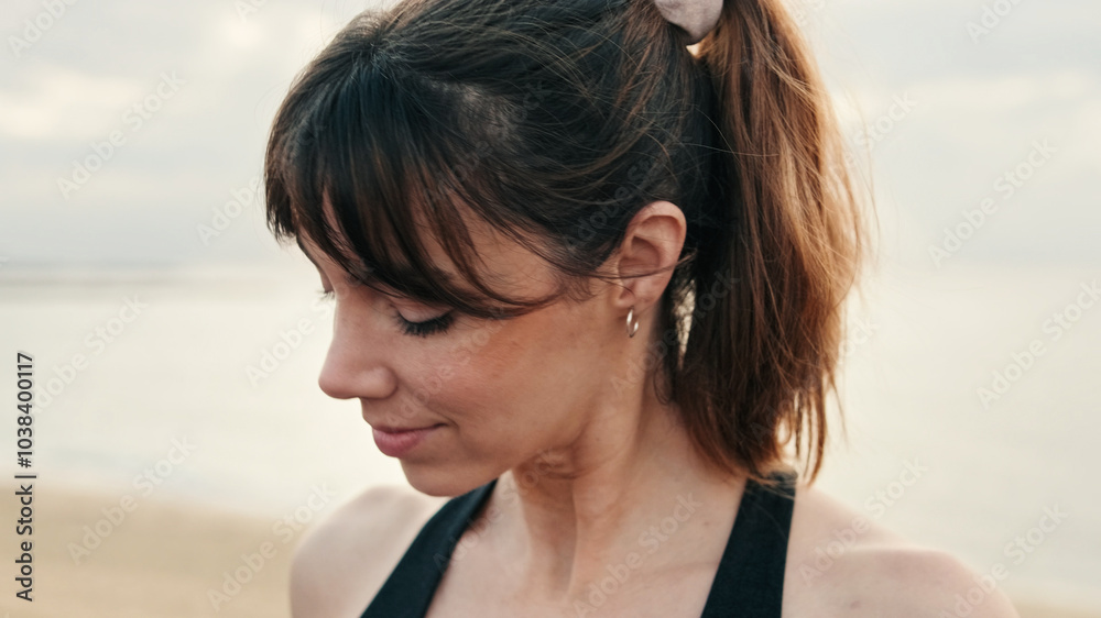 Mindful happy girl doing neck and shoulder exercises outdoors, active lifestyle and sports for health, outdoors relax Mindful happy girl doing neck and shoulder exercises outdoors, active lifestyle and sports for health, outdoors relax
