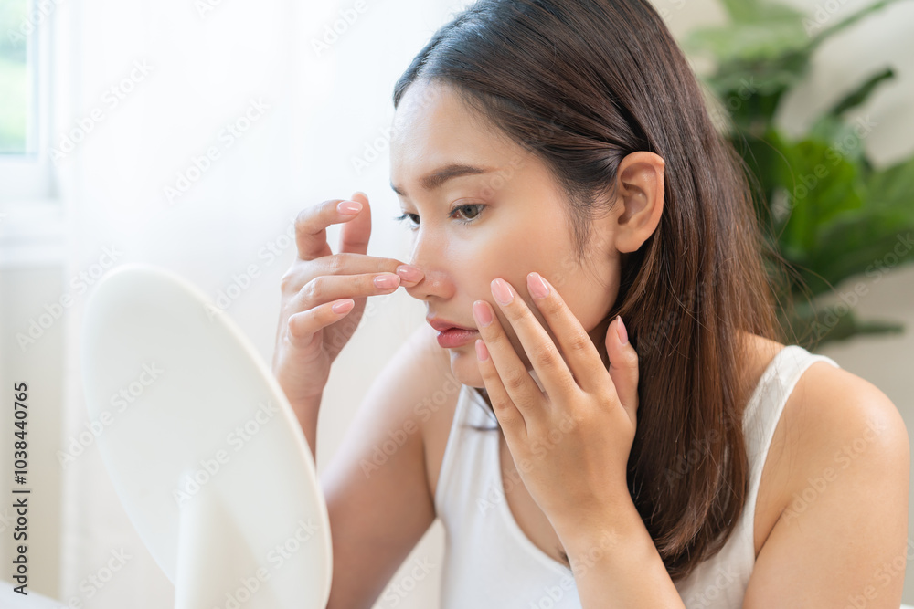 Anti wrinkle aging, worry puberty asian young woman, stressed looking in mirror, allergy presenting allergic reaction from cosmetic on face. Beauty, health care from acne problem, dry skin, treatment. Anti wrinkle aging, worry puberty asian young woman, stressed looking in mirror, allergy presenting allergic reaction from cosmetic on face. Beauty, health care from acne problem, dry skin, treatment.