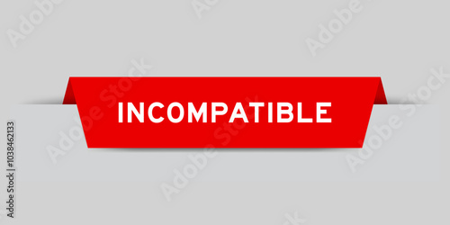 Red color inserted label with word incompatible on gray background