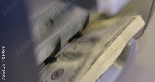 High quality video 6k 4:2:2 10bit downscale 4k .100 dollar bills counted in money counting machine. Cash money dollars into banknote counter. 