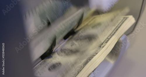 High quality video 6k 4:2:2 10bit downscale 4k .100 dollar bills counted in money counting machine. Cash money dollars into banknote counter. 