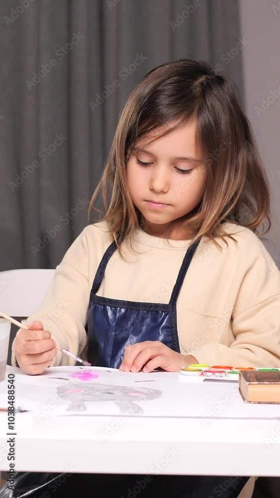 vertical video portrait little girl artist girl painting with watercolors vertical video portrait little girl artist girl painting with watercolors