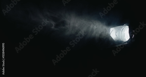 фотографія Within the dark, a potent directional light source shines, creating swirling fog
