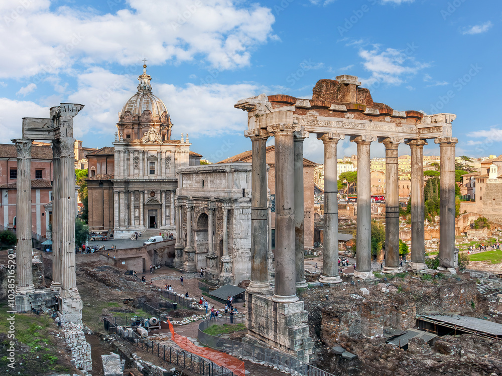The ancient ruins of the Roman Forum s in the heart of Rome, Italy, under a vibrant sky