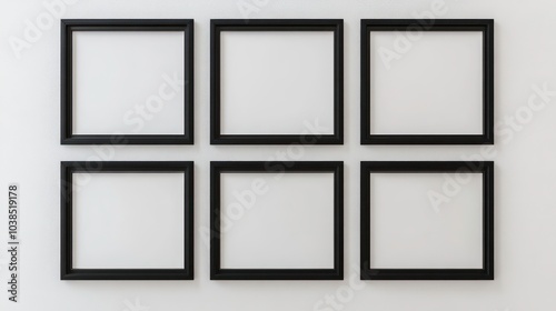 Six black picture frames on a white wall.