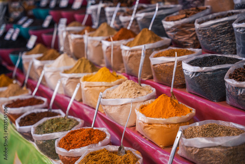 A counter in a store with spices in bags