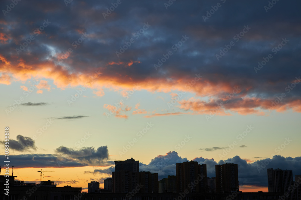 Sunset Behind Clouds with City Silhouettes Sunset Behind Clouds with City Silhouettes