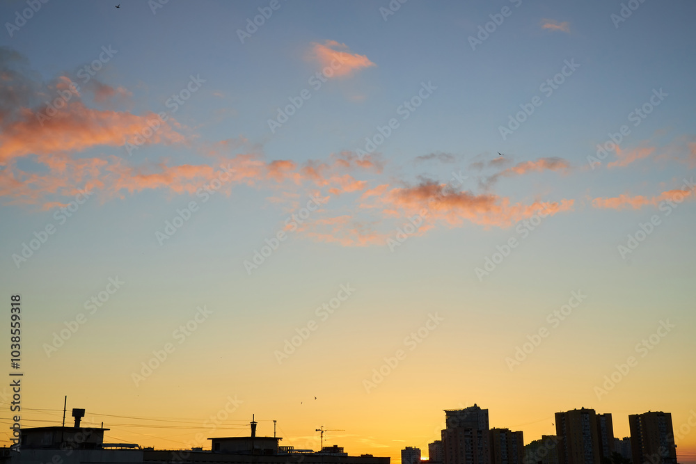 Pastel Sunset with Rooftops and City Silhouettes Pastel Sunset with Rooftops and City Silhouettes