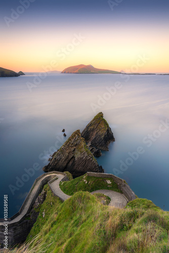 A winding path on Dingle Peninsula leads to cliffs above the ocean