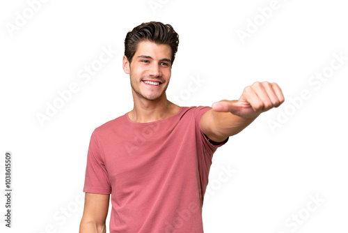 Young handsome caucasian man over isolated background giving a thumbs up gesture