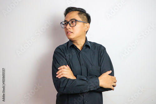 Crossed arms, happy and business Asian man in office for leadership, empowerment and success. Corporate, manager and portrait of person with funny joke in workplace for ambition, pride and confidence