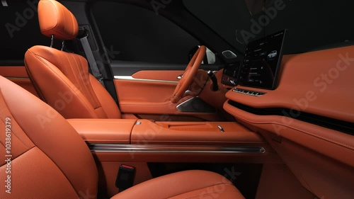Orange interior of a premium car. Terracotta trim inside the car interior. Modern technologies