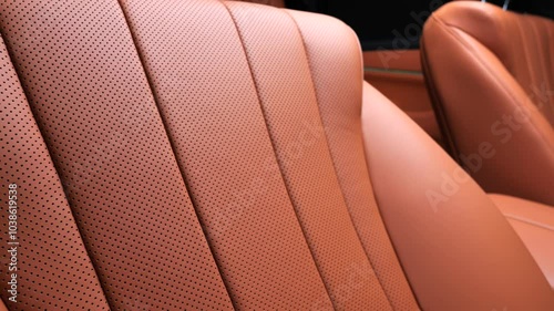 Orange interior of a premium car. Terracotta trim inside the car interior. Modern technologies