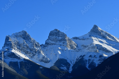 snow mountains in winter, Canadian Rockies, Three Sister Mt, Canmore Alberta, Banff