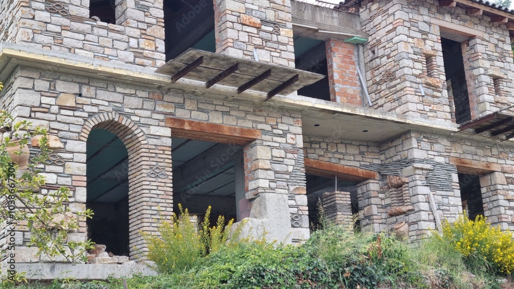 A traditional stone house is being renovated in the countryside A traditional stone house is being renovated in the countryside