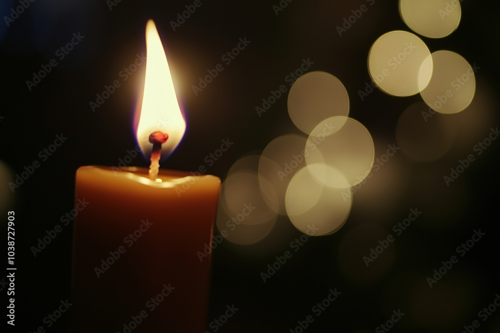 Lit candle with warm glow and bokeh lights Lit candle with warm glow and bokeh lights