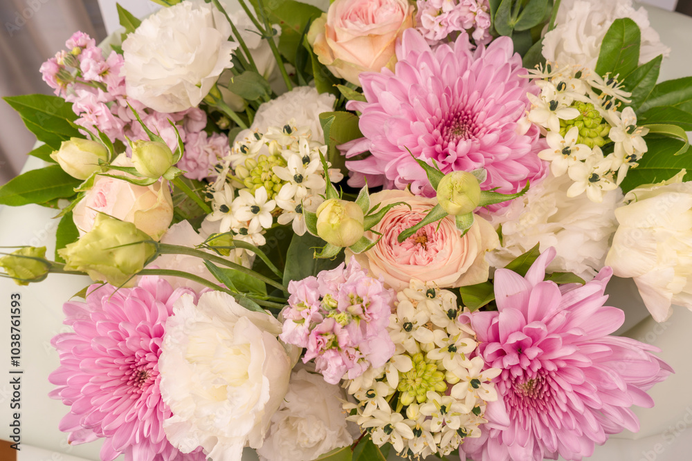 Bouquet of flowers with pink roses, chrysanthemum and freesia flower in a vase isolated on a white background. Bouquet of flowers with pink roses, chrysanthemum and freesia flower in a vase isolated on a white background.