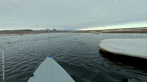Kayak adventure through icy waters in the Arctic. The footage captures the feeling of exploration and the beauty of nature in a cold environment.