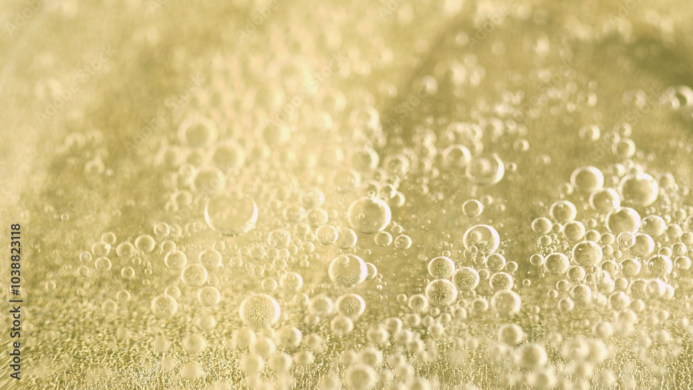 Bubble fluid. Oil water flow. Defocused golden color shiny air serum liquid swirl essential drop texture abstract art background. Bubble fluid. Oil water flow. Defocused golden color shiny air serum liquid swirl essential drop texture abstract art background.