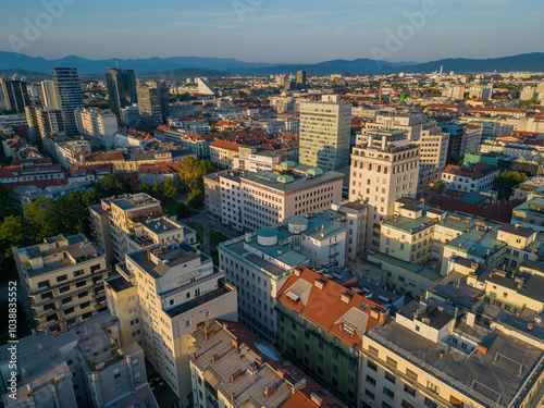 Obraz na płótnie Ljubljana city center skyline aerial view at sunset. Urban area with historic Neboticnik skyscraper towards business district on Dunajska road with skyscrapers of modern architecture in capital city. w salonie