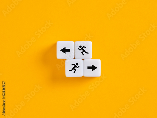 Man running towards the right direction choosing path with arrows on cubes