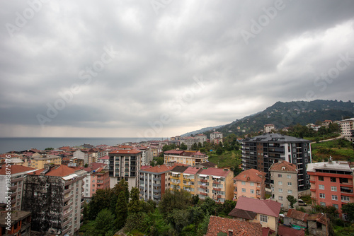 Panoramic View of Çayeli, Rize, Turkey Overlooking the Black Sea on a Cloudy Day with Coastal and Urban Scenery photo