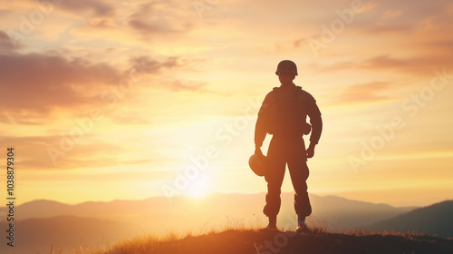 Soldier Silhouette at Sunset Holding Helmet in Reflection