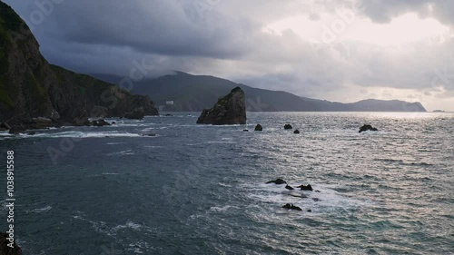 Cliff of San Juan de Gaztelugatxe on a cloudy day and rough sea. Bilbao, Basque Country in Spain