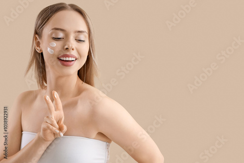 Pretty young woman with cre...