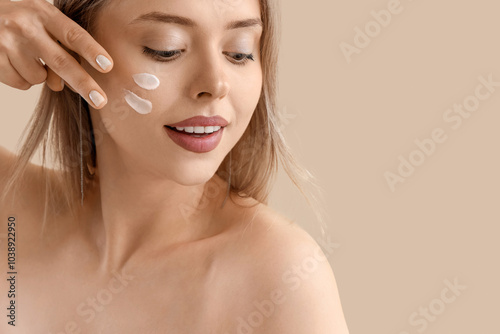 Pretty young woman with cre...
