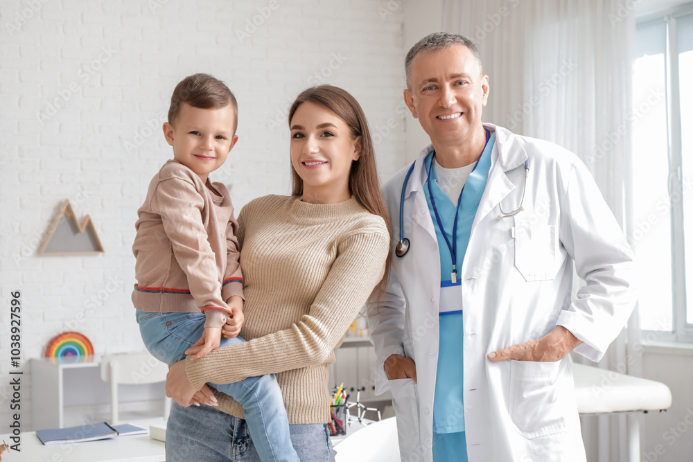 Fototapeta premium Little boy with mother at pediatrician's office