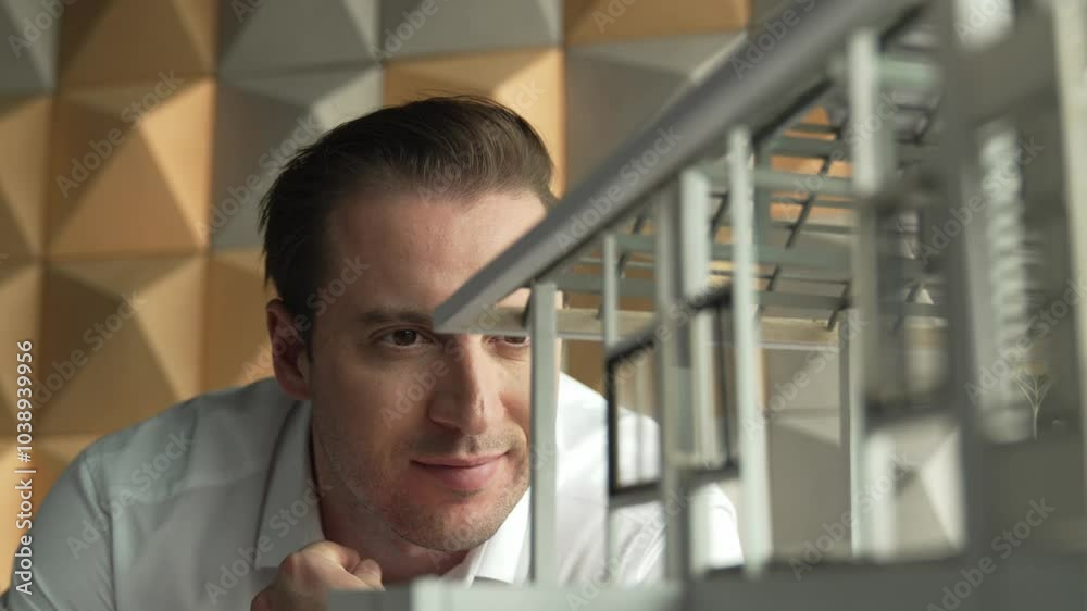 Closeup of professional engineer face looking at house model while inspect building structure and mistake points. Skilled project manager checking house model. Business design concept. Manipulator.